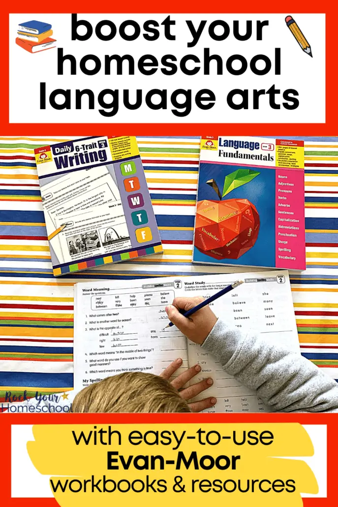 Young boy using blue pencil in spelling workbook with other Evan-Moor workbooks for language arts in the background on striped tablecloth